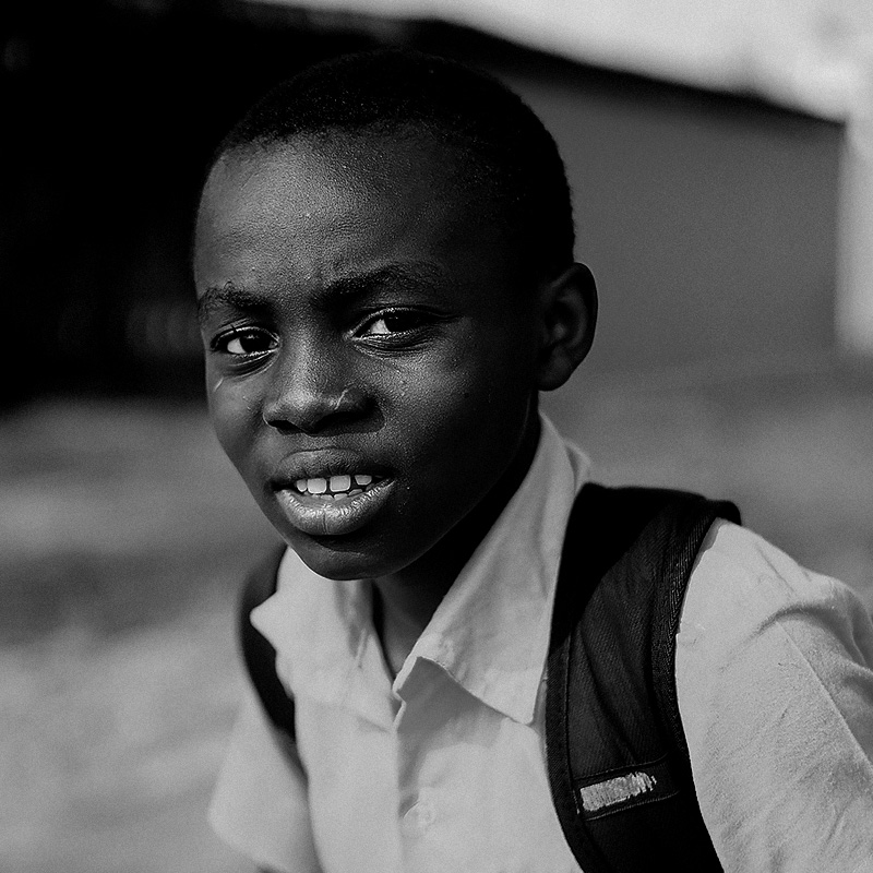 closeup-photo-of-boy-sits-on-stairway-1442751
